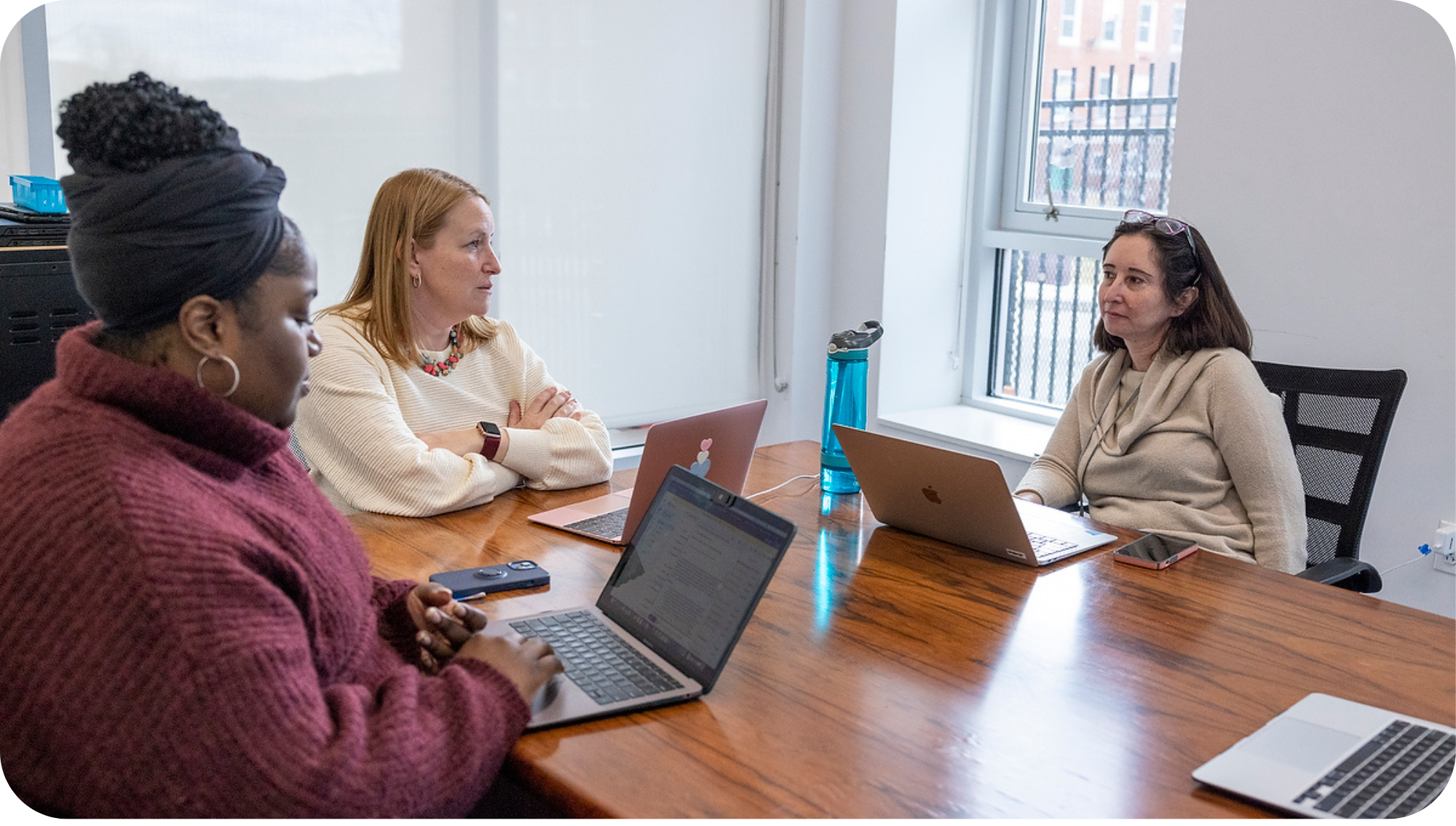 The Ability Challenge Team having a meeting with a partner.