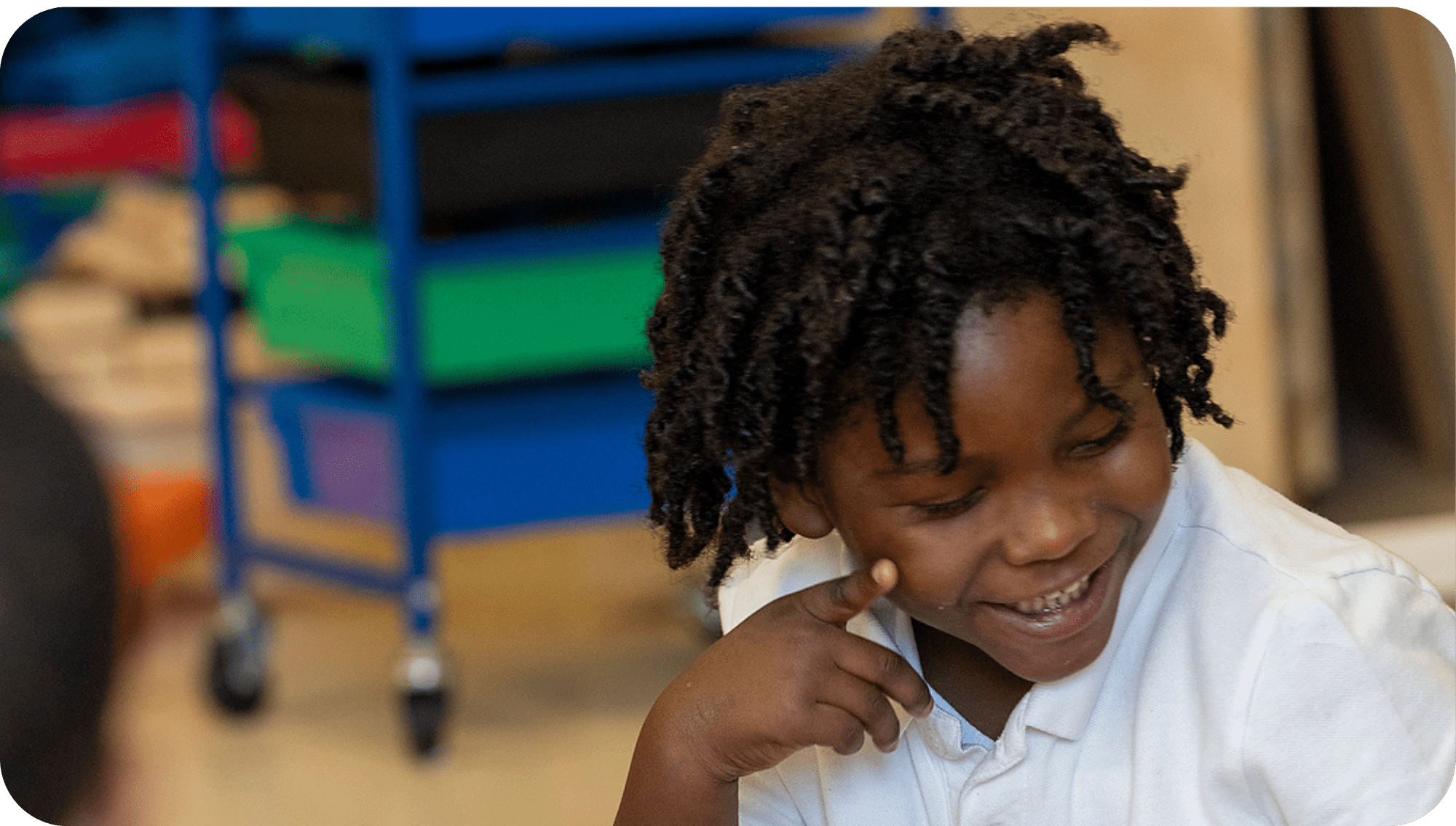 student smiling in the classroom